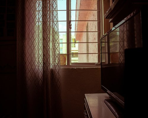 A well-lit desk near a window on a sunny day in Mexico